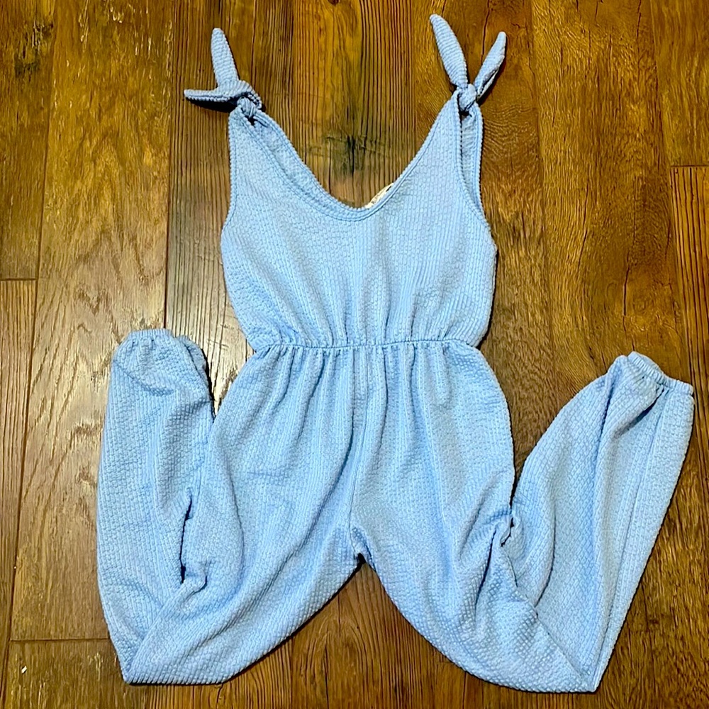 Light blue jumpsuit. Very light weight and comfortable.